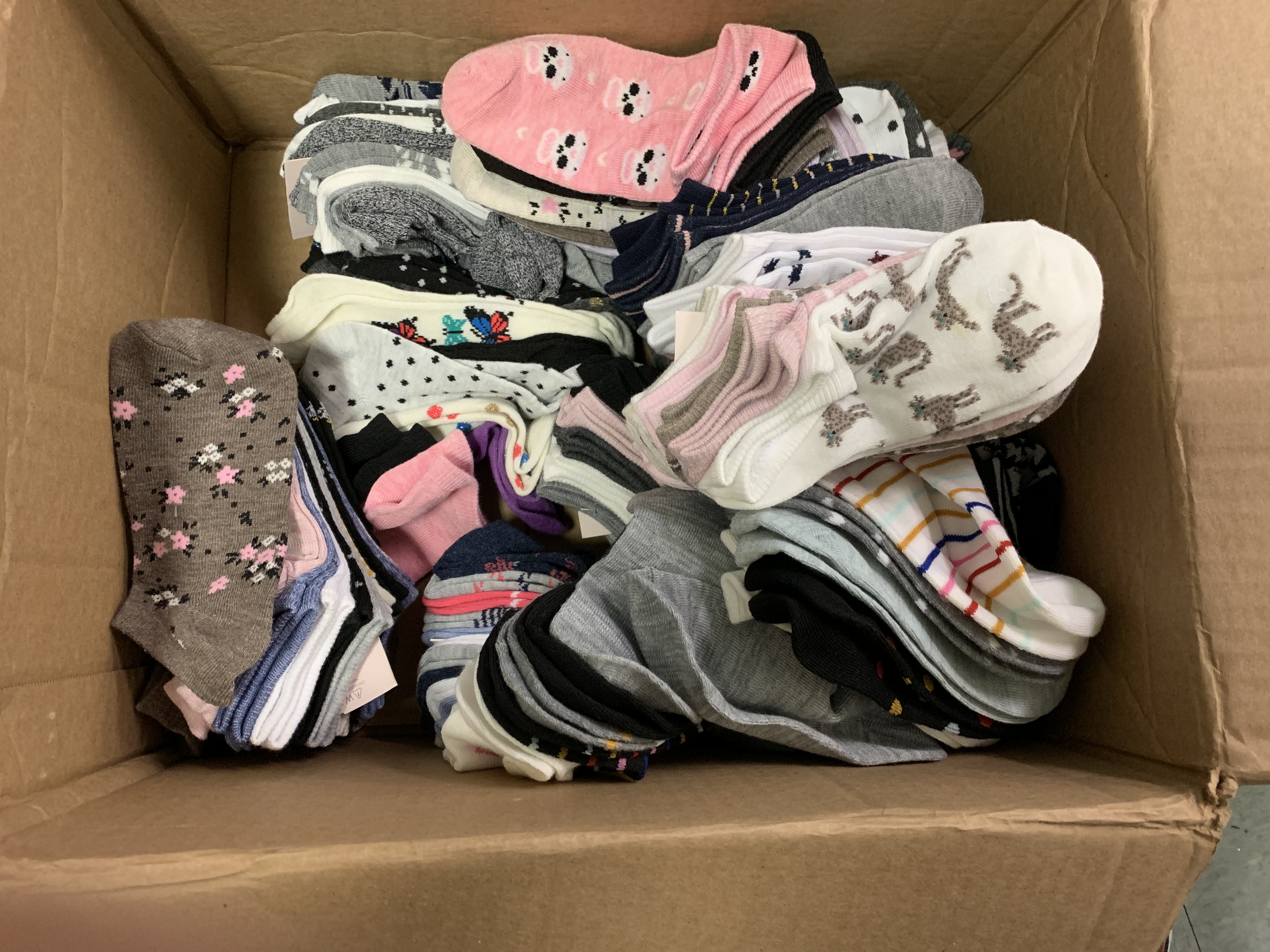 box of socks donated to Children's Aid NYC